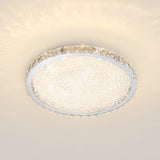 Round LED crystal ceiling light, lit white glass panel with crystal rim