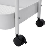 Close-up of black caster wheels under the white rolling clothes rack