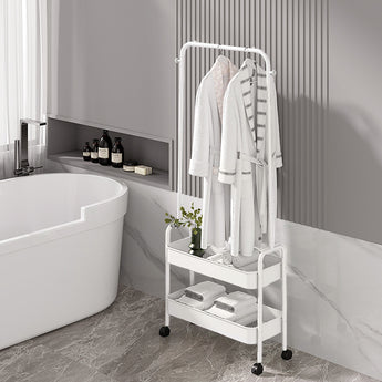 White rolling clothes rack with hanging bar and two lower shelves for garments