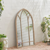 Tall arched window mirror in metal frame, wall-mounted view from side