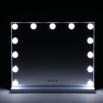 Hollywood makeup mirror with LED bulbs glowing around a dark reflective surface