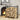 Black iron log holder packed with split firewood beside fireplace