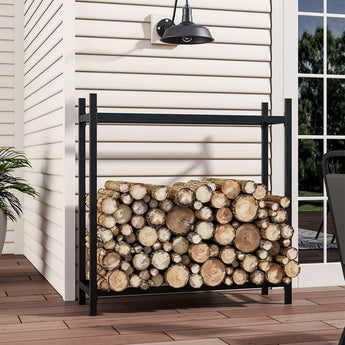 Black iron log holder with stacked round firewood logs inside