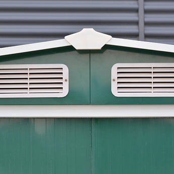 Gabled roof gable panel with two front ventilation grilles on green metal shed