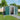 257cm wide metal garden tools storage shed with gabled roof, green side walls and open door