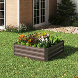 Square raised garden bed planter box with gray metal sides and colorful spring bulbs