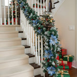 Artificial LED Christmas garland with blue flowers and warm white lights on staircase