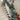 Artificial LED Christmas garland with blue flowers and warm white lights on staircase