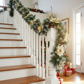 Artificial LED Christmas garland with cream star flowers and warm white lights on railing