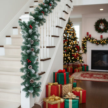 Artificial LED Christmas garland with pine cones, red berries, and warm white lights