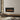 Wall-mounted electric fireplace with black frame and glowing flame insert