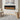 Wall-mounted electric fireplace with black frame and bright orange flame window