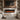 Black electric fireplace with realistic orange flame effect in a recessed wall unit