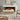 Freestanding electric fireplace with white mantel and dark frame, orange flame display in hearth.