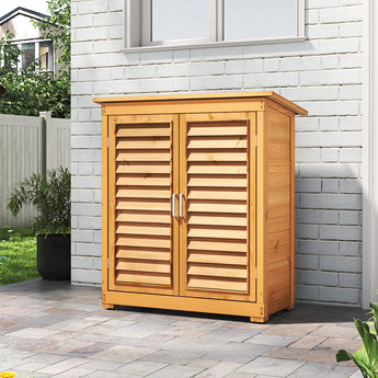 Outdoor wooden storage shed with double louvered doors closed, front view