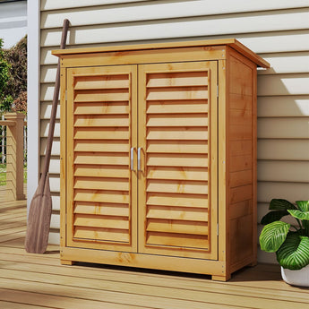 Outdoor wooden storage shed with double louvered doors open, front view