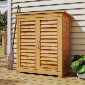 Outdoor wooden storage shed with double louvered doors open, front view