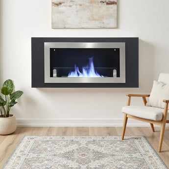 Wall-mounted bio ethanol inset fireplace with dark rectangular frame and glass front, burning flames