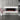 White electric fireplace mantel with red flame effect and log/coal fuel bed