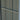 Grey zinc steel side wall with vertical corrugated panels and horizontal trim bar