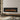 Wall-mounted electric fireplace with long flame window and black bezel trim