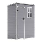 Grey plastic storage shed with white trim door and two-pane window, closed