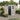 Grey plastic garden storage shed with lockable door and two-pane window