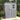 Grey lockable plastic storage shed with white frame door and two-pane window