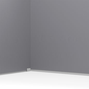 Inside corner of plastic garden storage shed with gray wall panel and white base trim