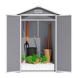 Plastic storage shed interior with gray panels and shelf space for tools and planters