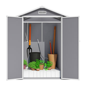 Plastic storage shed interior with gray panels and shelf space for tools and planters