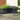 L-shaped raised metal garden bed with dark gray corner panels and wide planters