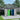 Outdoor metal garbage storage shed with hinged lid open, double doors with two trash bins