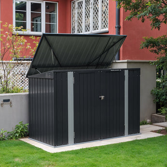 Outdoor bike storage shed with dark-gray metal panels, sloped roof, and lockable double doors