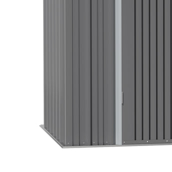 Side wall of metal garden shed with vertical corrugated panels and door edge