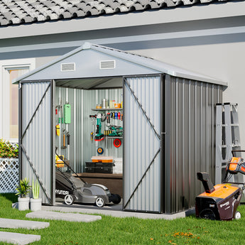 Open metal shed with tool storage inside, grey corrugated walls and roof vents