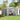 Outdoor tool storage shed, open double doors with visible tool wall organizer