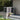 Bicycle storage shed with sliding-style panel doors, light gray frame and dark gray panels