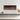 Electric fireplace insert with glass front showing orange flames and top control lights