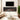 Electric fireplace with black frame and orange flames in a recessed wall opening