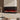 Recessed electric fireplace with red flame effect and black front frame