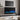 60-inch recessed electric fireplace with blue flame effect and front control panel