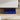 Recessed electric fireplace with blue flame effect and visible control buttons