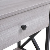 Close-up of drawer front and round knob on rustic grey console table