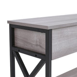 Side view of rustic grey console table with black cross-brace frame and shelf below