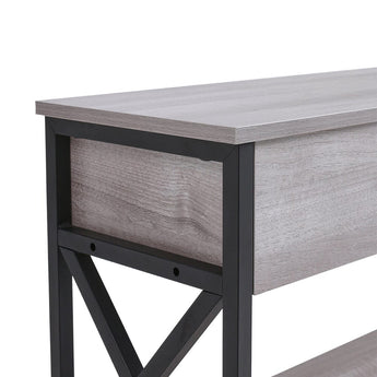 Side view of rustic grey console table with black cross-brace frame and shelf below