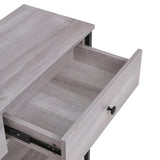 Open drawer interior on rustic grey console table with dark hardware