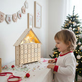 Wooden Christmas advent calendar with glowing LED lights and numbered doors, front view
