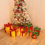 LED Christmas gift box decorations, red boxes with green ribbon bows, warm lights
