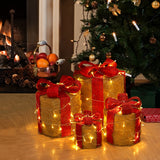 LED Christmas gift box decorations, beige-and-red boxes with green ribbon, lit